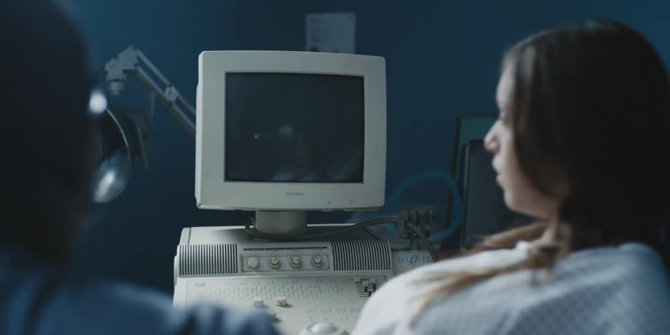A woman is being examined by a doctor