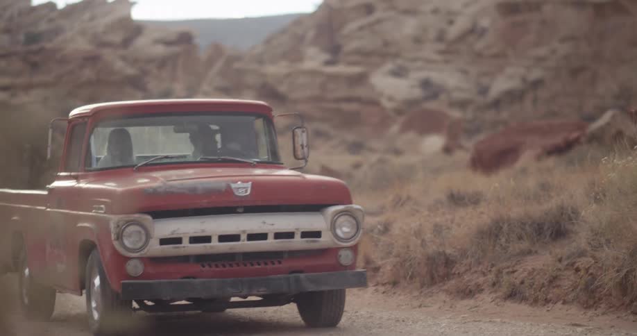 Man driving in a truck with a woman