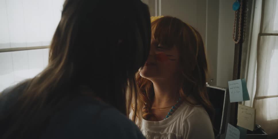 A woman and her child rub noses together