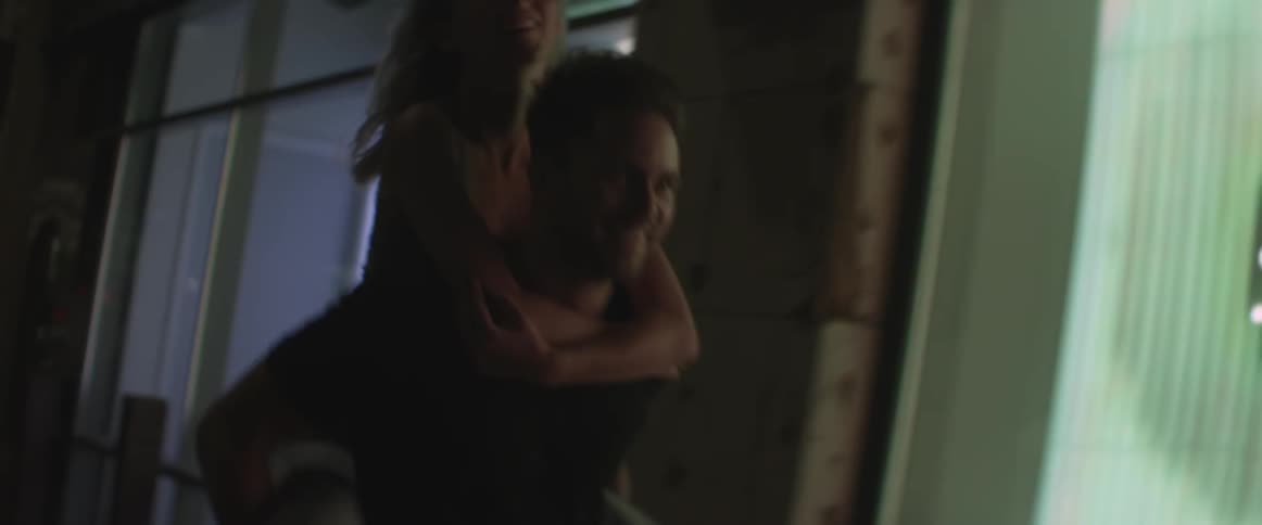 Man giving a woman a piggyback ride