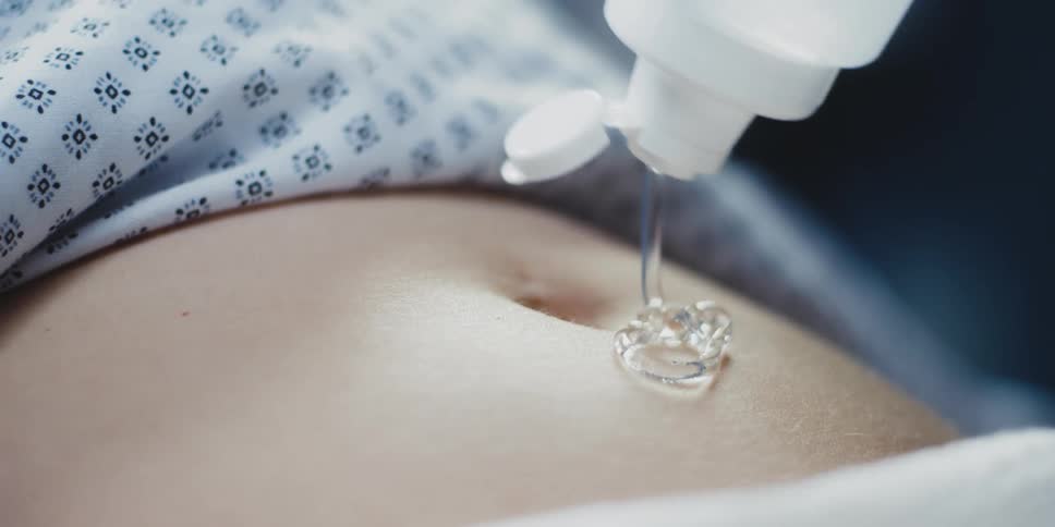 Gel being squeezed onto a person's stomach