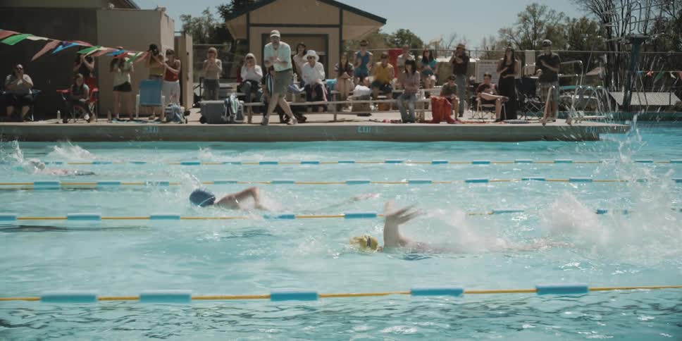 People watching a swimming match