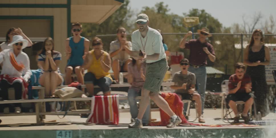 Parents cheer on swimmers in the pool