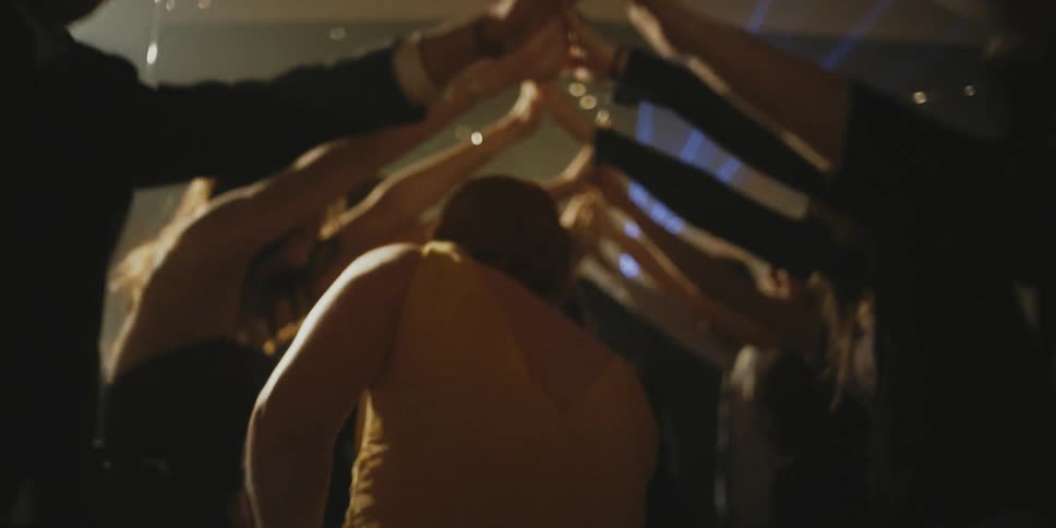 Teenagers dance and celebrate at a prom