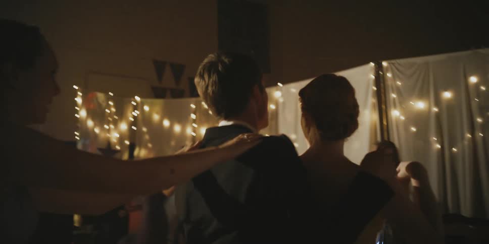 Teenagers dance at a prom