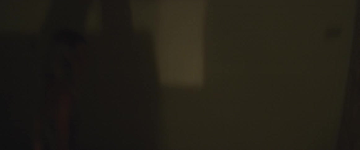 Two people climbing stairs rapidly in a stairwell