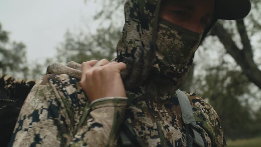 Two men are hunting in the wilderness