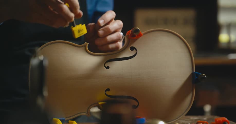 A person is building a violin