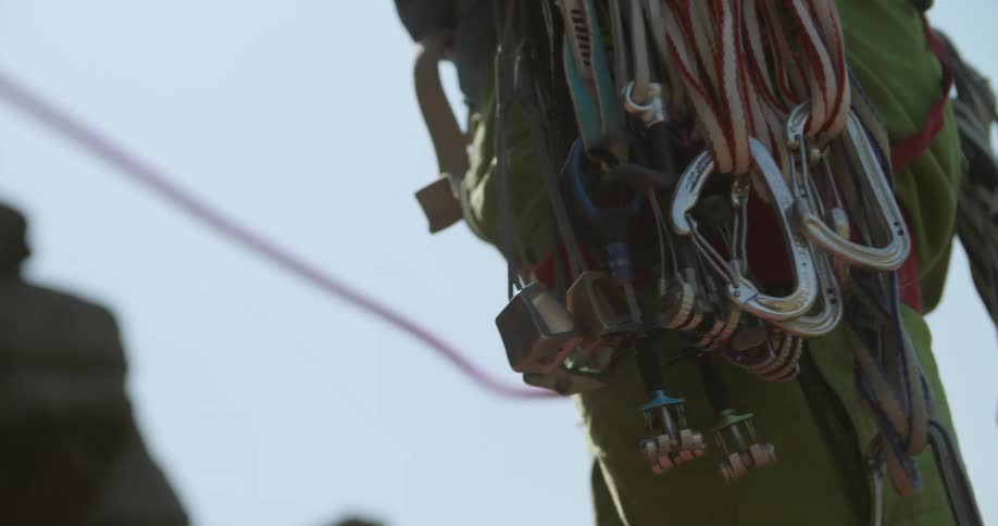 A climber belaying climbing rope