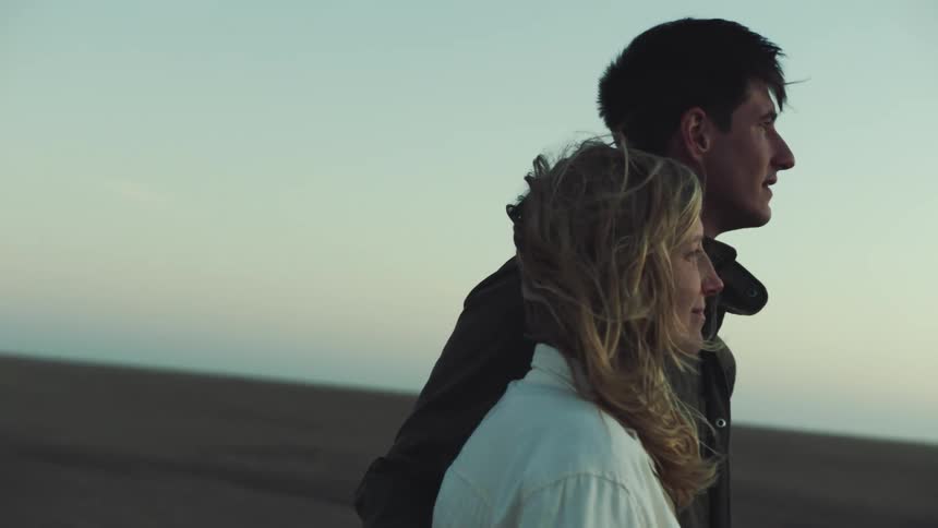 Man and woman share a peaceful moment together in the desert