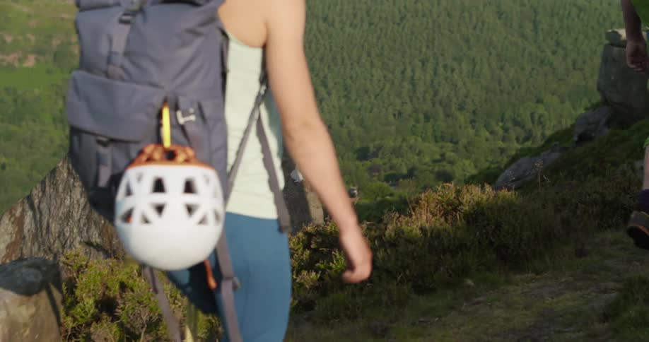 Two people are hiking on the hills