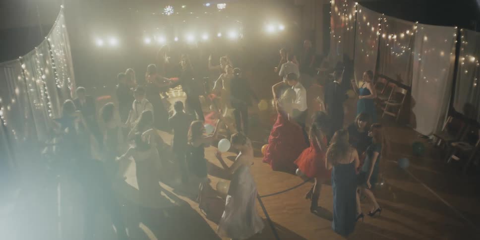 People celebrate and dance on the dance floor