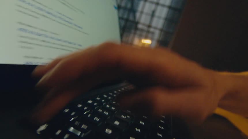 dynamic shot of hand pressing the escape key on the keyboard of a laptop