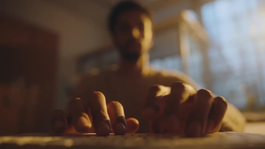 close up focus of man typing on a keyboard