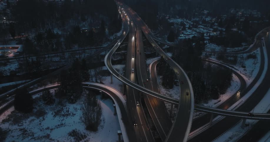 City commuters drive on an icy highway during a winter storm