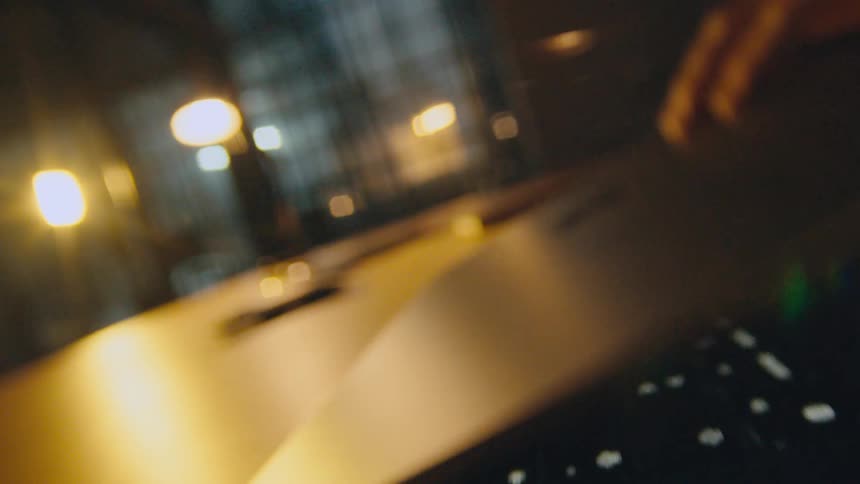 camera flies through laptop being closed