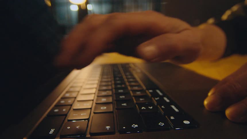 camera flies with hand over keyboard turning off screen