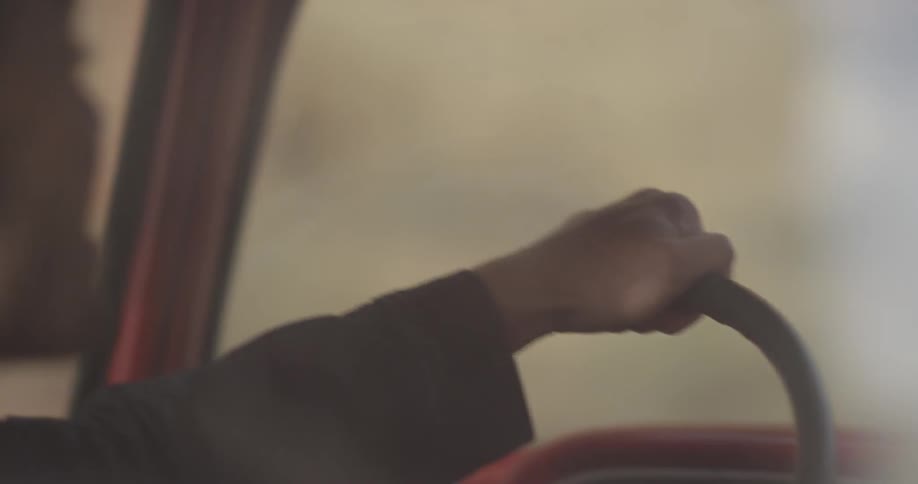 Man smiling and driving a truck
