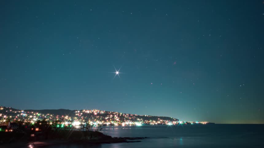 The sky is full of stars by the shore