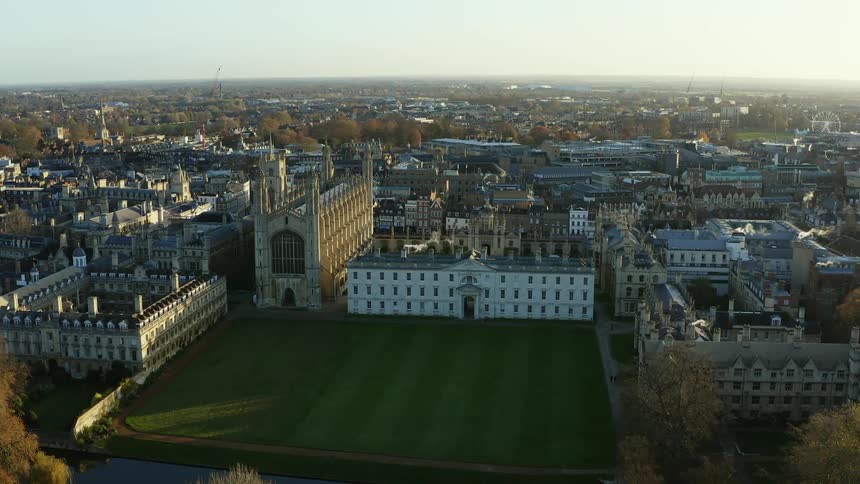 The green lawn and building of Kings College Chapel at the University Of Cambridge