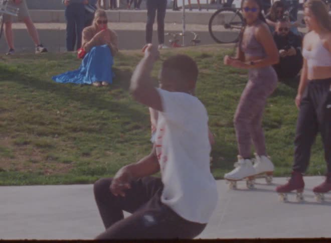 A view of a person dancing outdoors