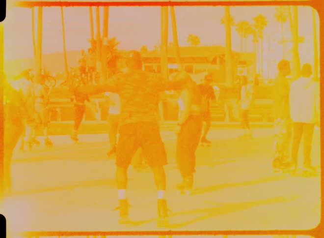A man twirls and spins on roller skates near venice beach
