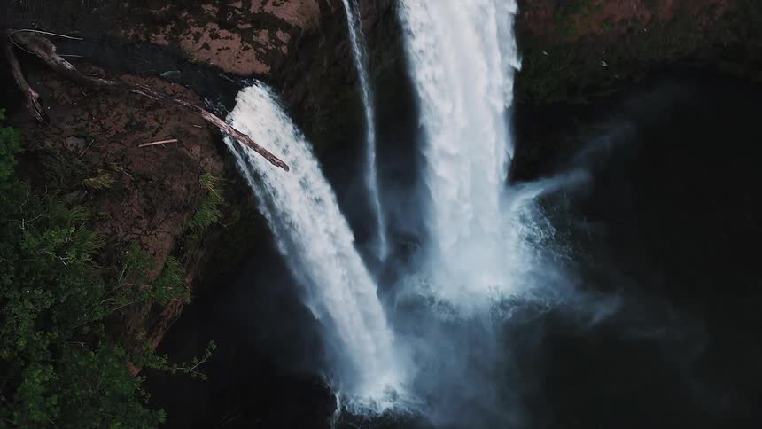 Water falling off of a tall cliff