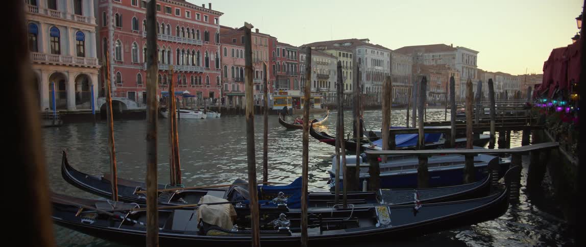 Gondolas on the Grand Canal in Venice with Palazzo Bembo and other palazzos along the banks