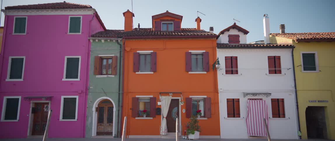 Row of colorfully painted houses on Burano Island, Venice, Italy
