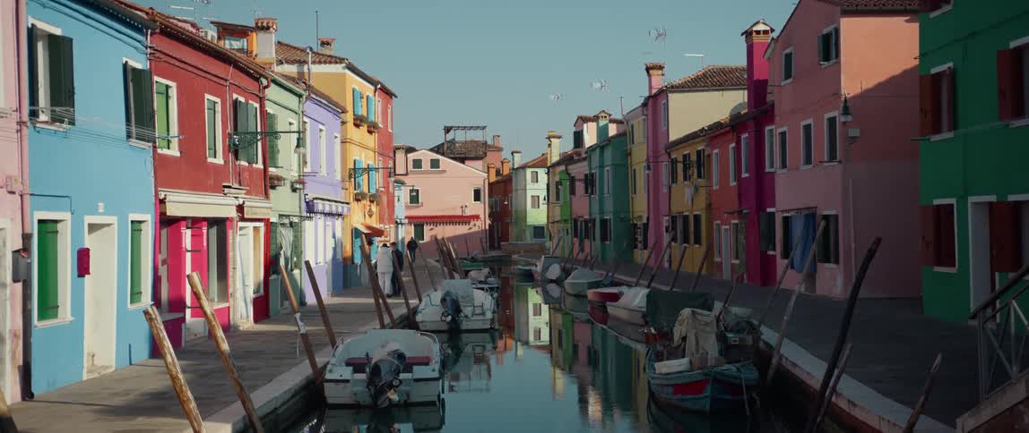 A view of colorful mediterranean buildings along a canal on Burano Island, Venice, Italy