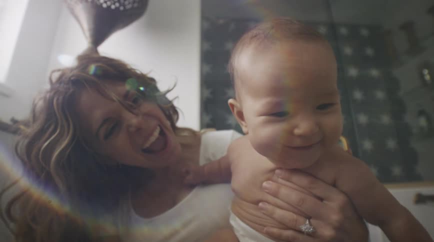 A mother about to bathe her son