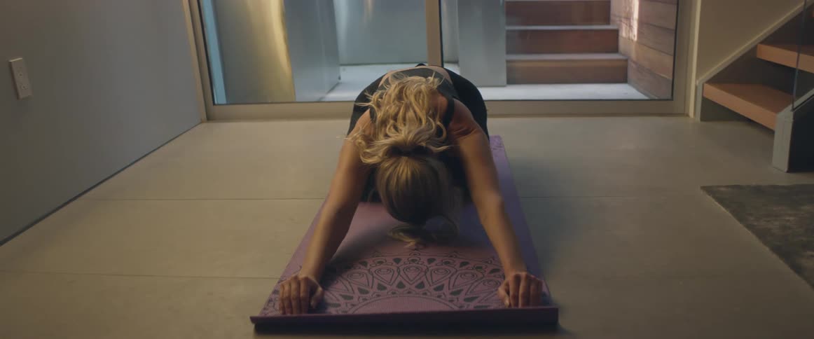 A woman is performing yoga