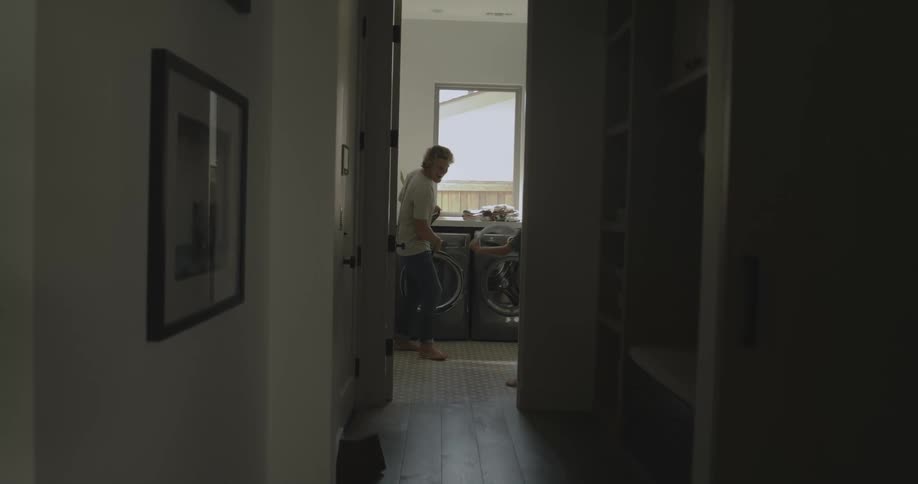 Father and son play with each other in wash room