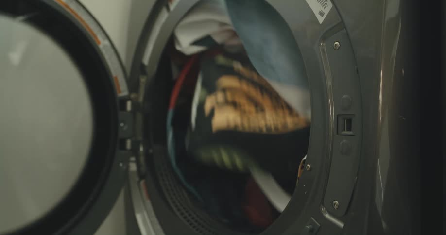 A person doing laundry in a room