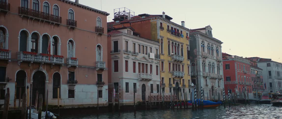 Colorful buildings, palazzos, boats and gondolas along the Grand Canal in Venice, Italy