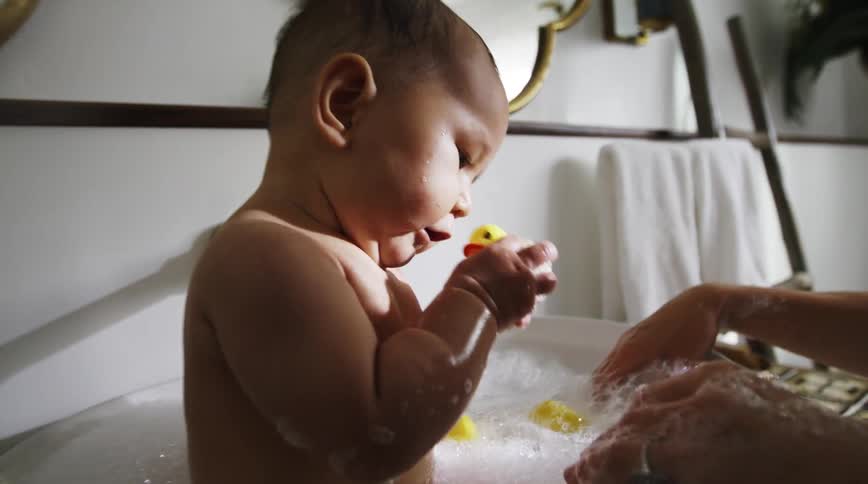 A mother giving her baby a bath