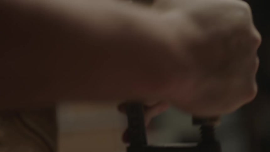 A man is turning a tool tightening it