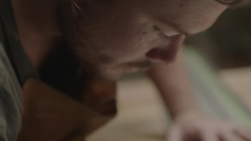 Man concentrates on the project he is measuring