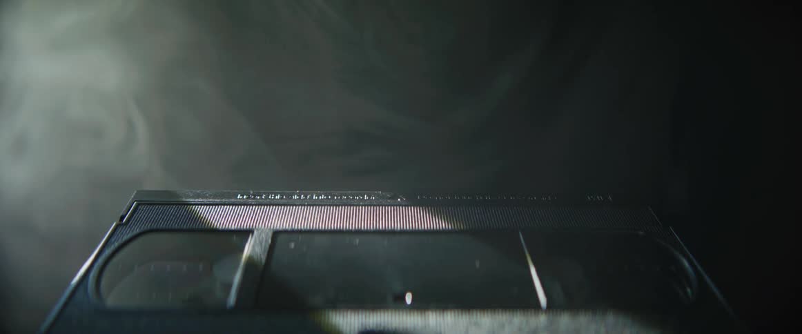 Black vcr tape surrounded by smoke