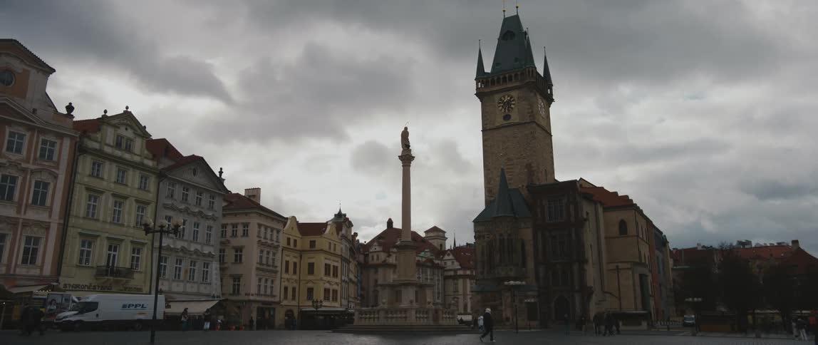 View on a cloudy day of the Mariana Columna and the Prague Astronomical Clock Tower in Czech Republic