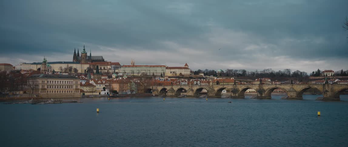 View over the River Vltava towards Charles Bridge, Old Town, and Prague Castle complex, Czech Republic