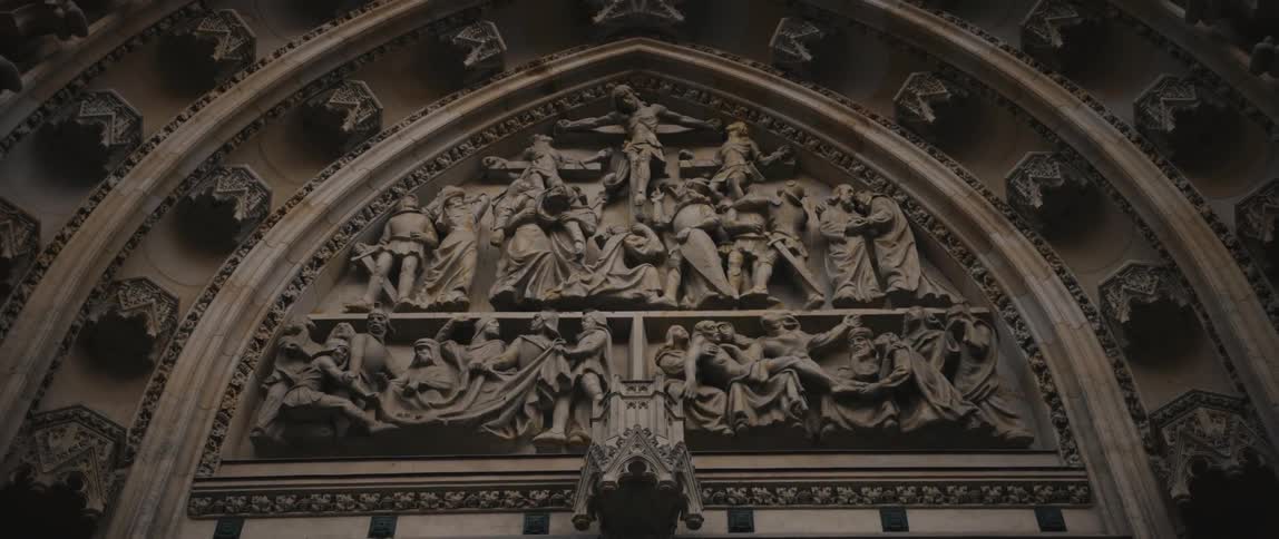 The elaborately sculpted tympanum over the entrance of Saint Vitus Cathedral, Prague, Czech Republic