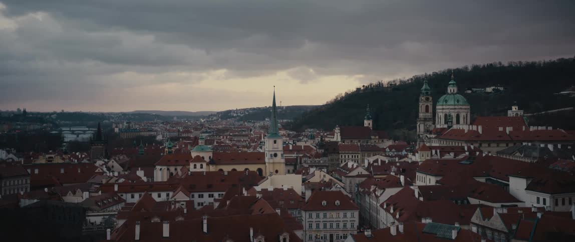 Panorama of Prague on a cloudy day with a view of the beautiful dome and baroque architecture of Saint Nicholas Church Mala Strana
