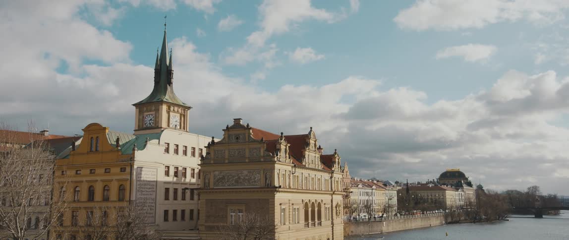 View from Charles Bridge over the Vltava River of the Bedrich Smetana Museum and Old Town Water Tower in Prague, Czech Republic