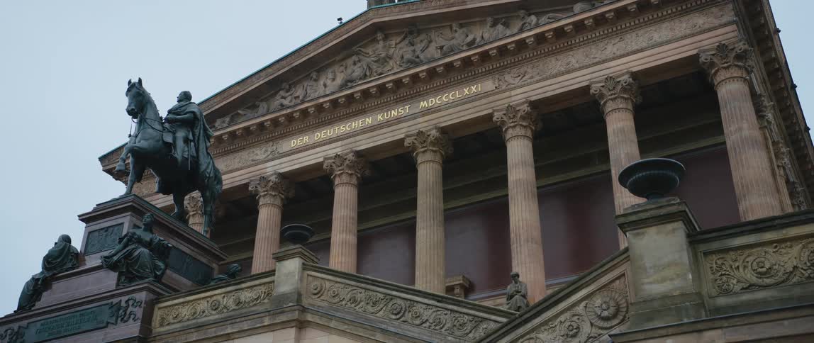 The equestrian statue of Friedrich Wilhelm IV guards the entrance staircases to the Alte Nationalgalerie Museum in Berlin, Germany