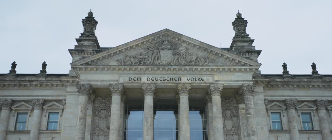 The inscription Dem Deutschen Volke meaning "To the German People" at the entrance to the Reichstag building in Berlin, Germany