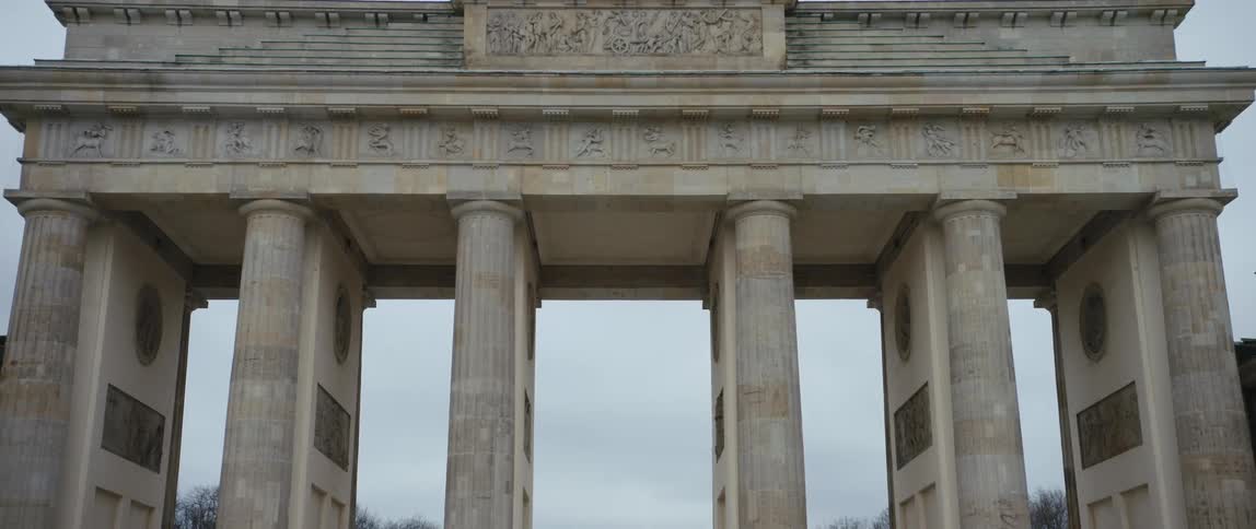 View of the Brandenburg Gate panning down from the quadriga above to the pathway beneath.