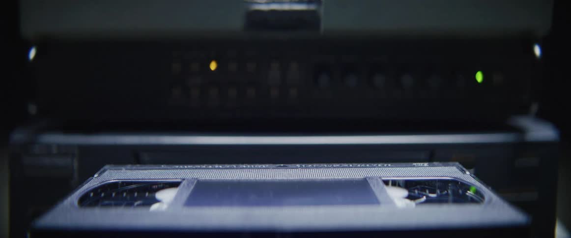 A videotape is inserted into a vcr