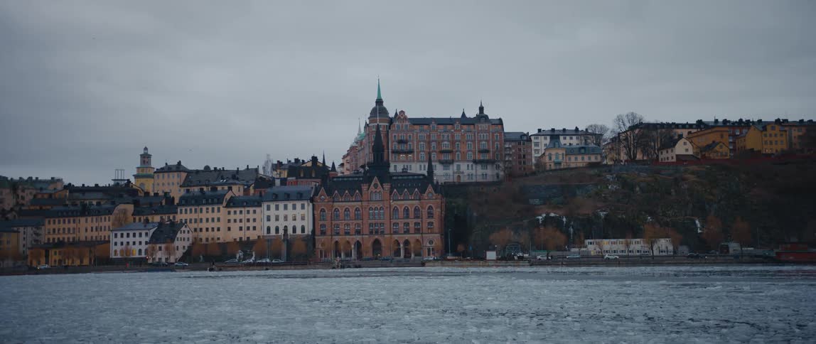 Cars travel on a road through stockholm sweden on a cloudy day