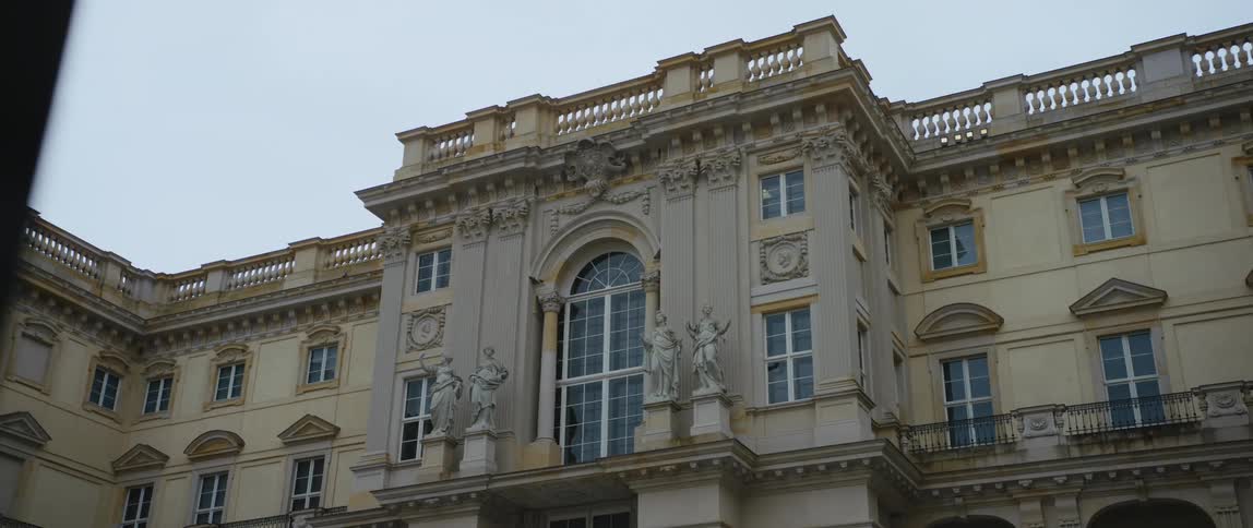Statues on pillars and ornate architecture of the rebuilt Berlin Royal Palace and Humboldt Forum museum in Berlin, Germany